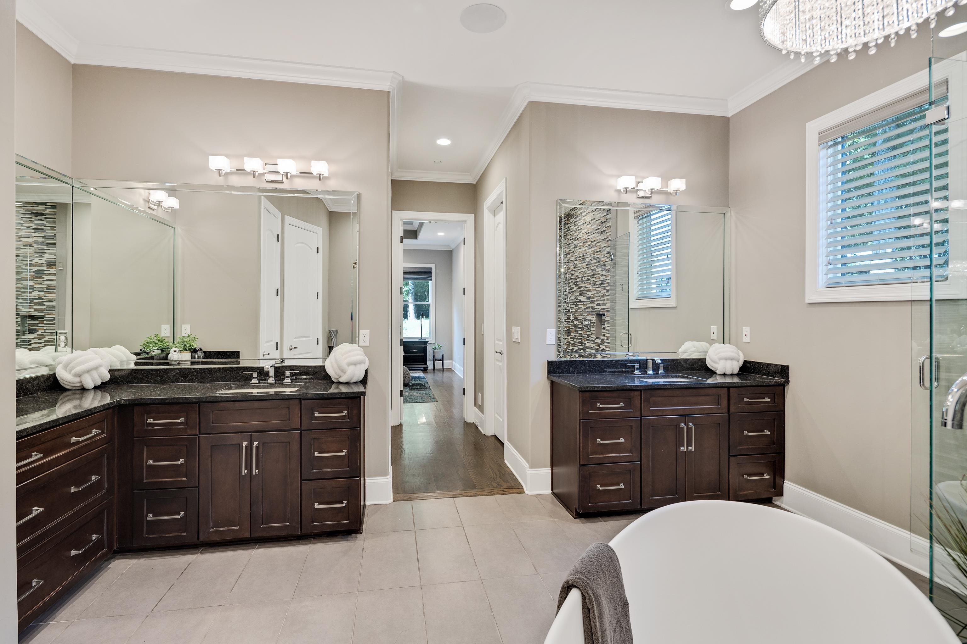 35 Spruce Valley Lane Piperton, TN 38017 - Photo 23 of 39 a spacious bathroom with a granite countertop double vanity sink a mirror a and a shower