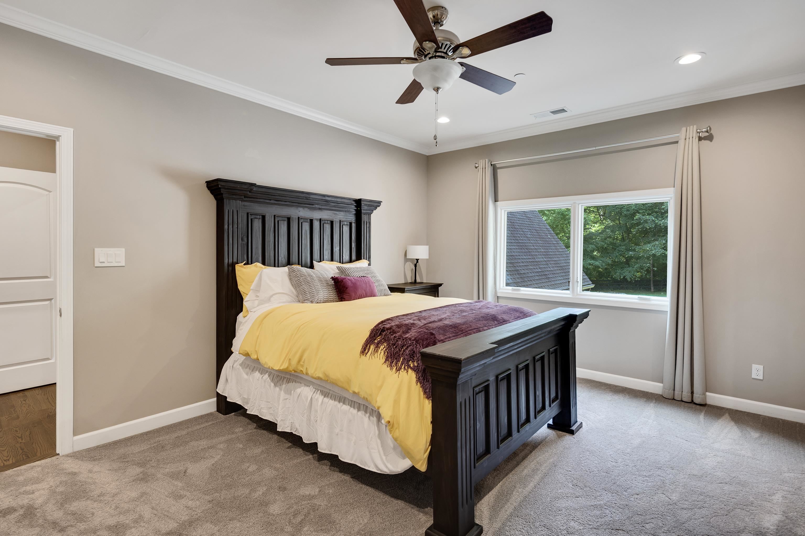 35 Spruce Valley Lane Piperton, TN 38017 - Photo 28 of 39 a bed sitting in a spacious bedroom next to a window