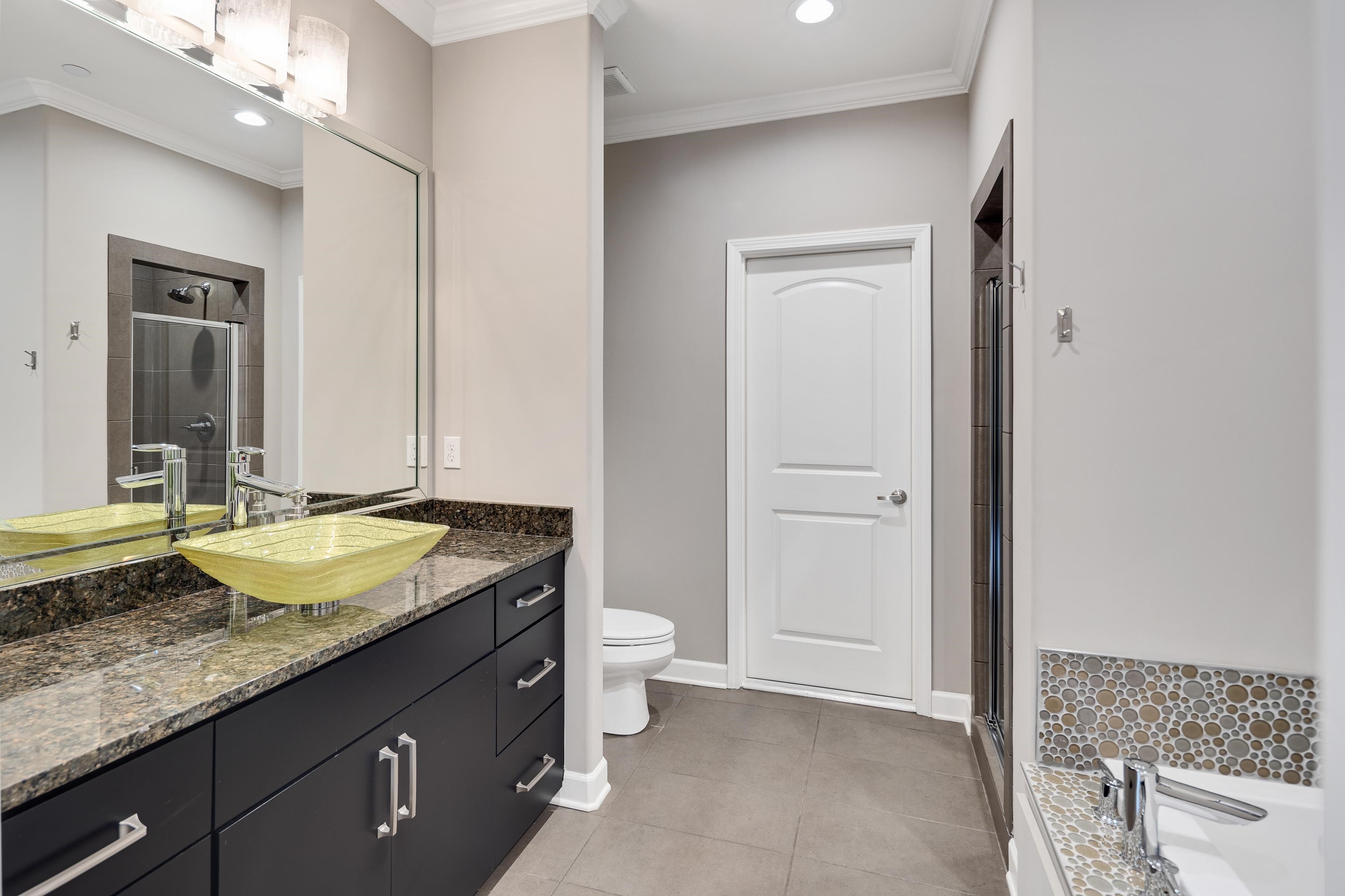 35 Spruce Valley Lane Piperton, TN 38017 - Photo 29 of 39 a bathroom with a granite countertop sink and a mirror