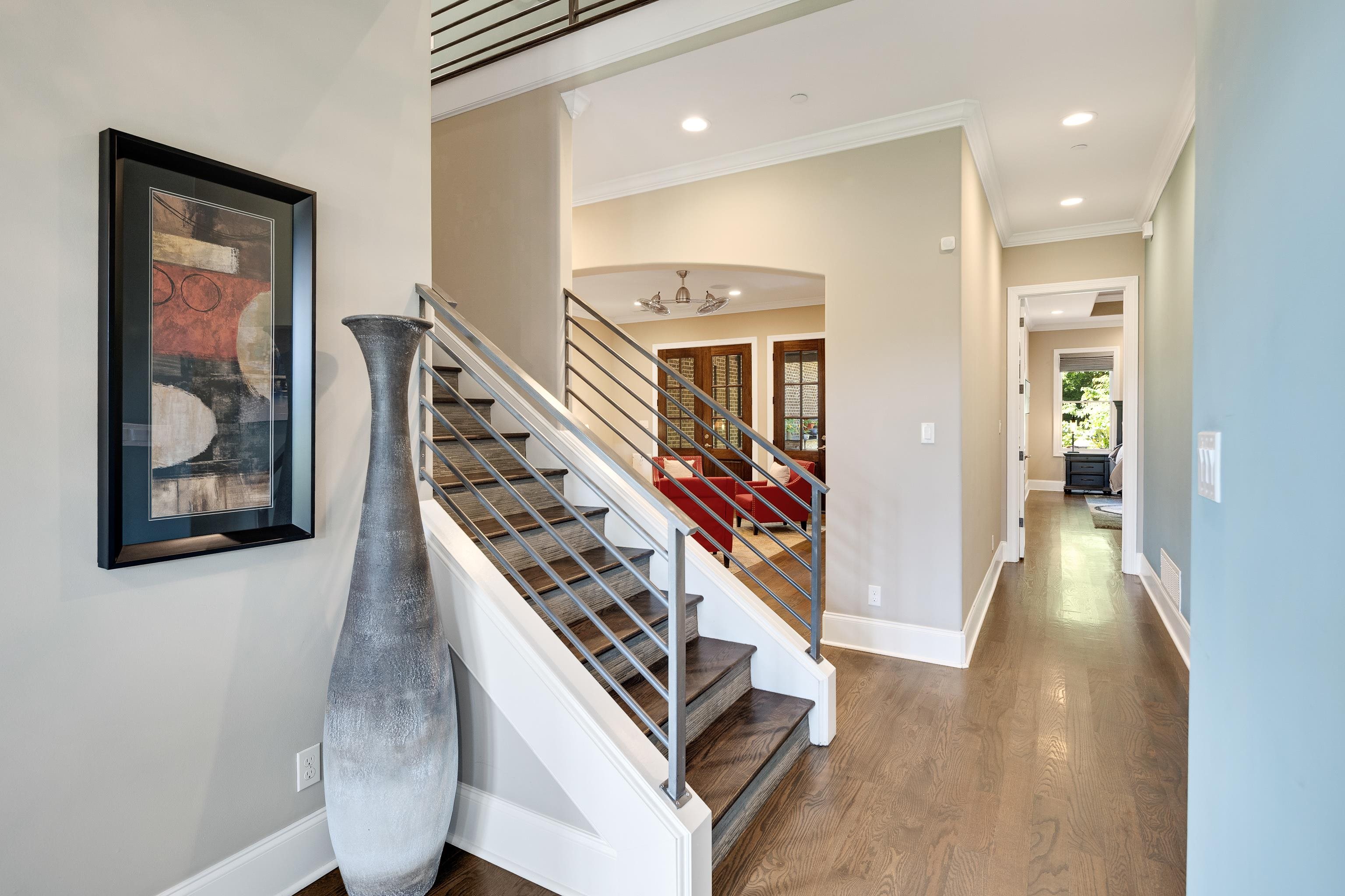 35 Spruce Valley Lane Piperton, TN 38017 - Photo 4 of 39 a view of a hallway with wooden floor and staircase