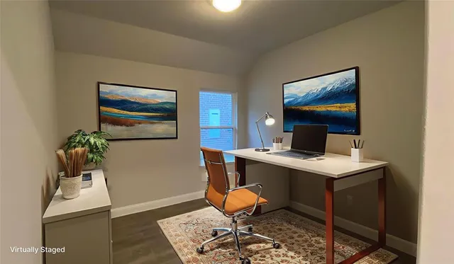 a view of a workspace with furniture