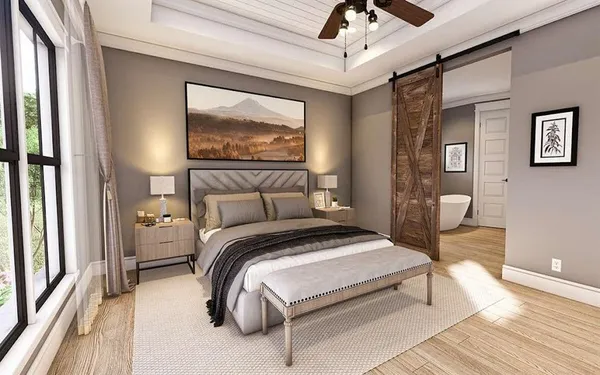 a bedroom with a bed and wooden floor