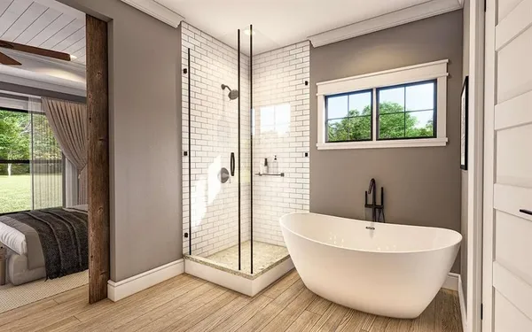 a bathroom with a bathtub and windows