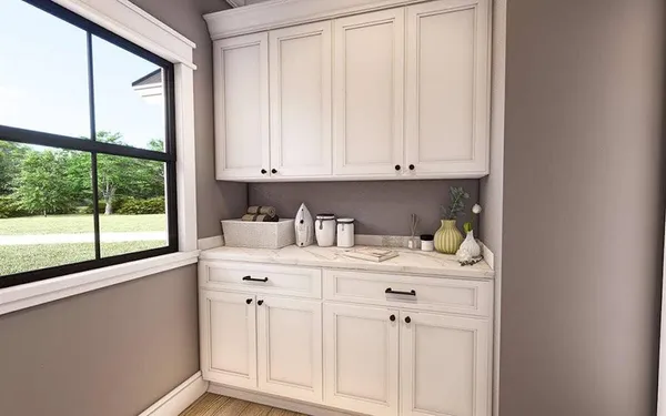 a view of window with white cabinets