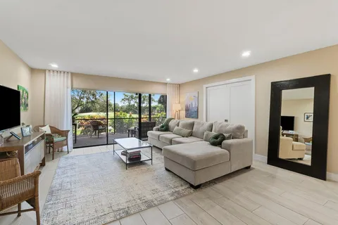 a bedroom with a large bed and a flat screen tv