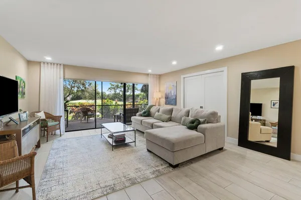 a bedroom with a large bed and a flat screen tv