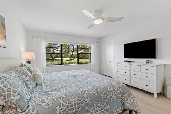 a bathroom with a double vanity sink mirror double and bathtub