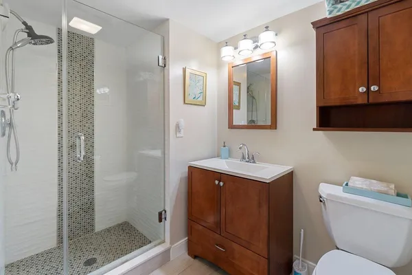 a living room with furniture and floor to ceiling windows