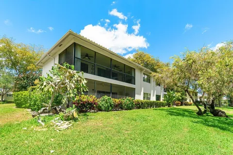 a view of a pathway both side of house