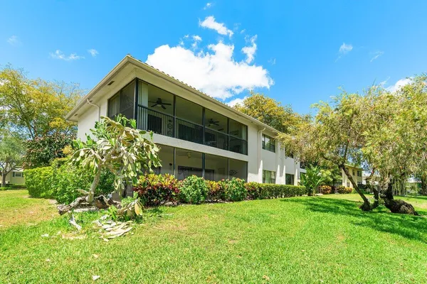 a view of a pathway both side of house