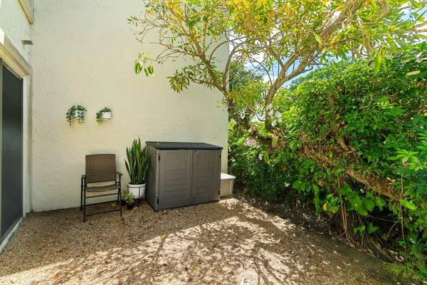 a view of yard with swimming pool and trees