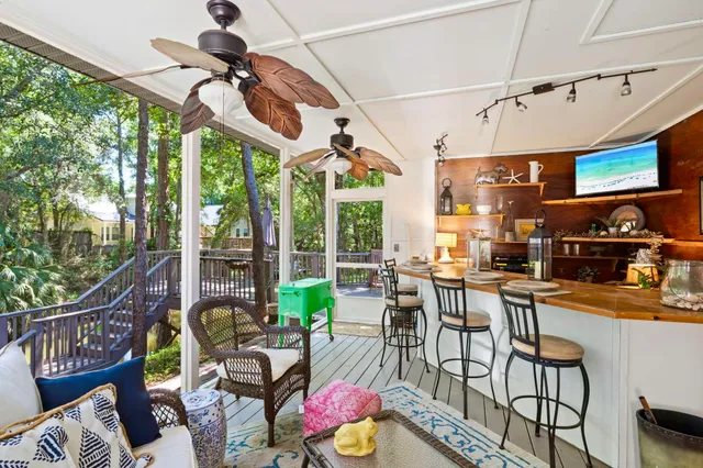 a view of a dining room with furniture one side kitchen view