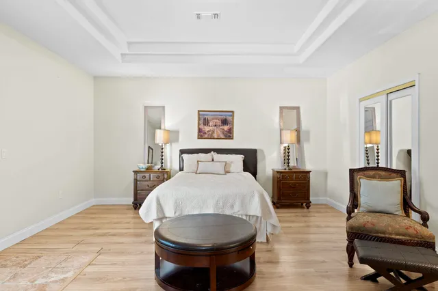 a room with a bed and furniture