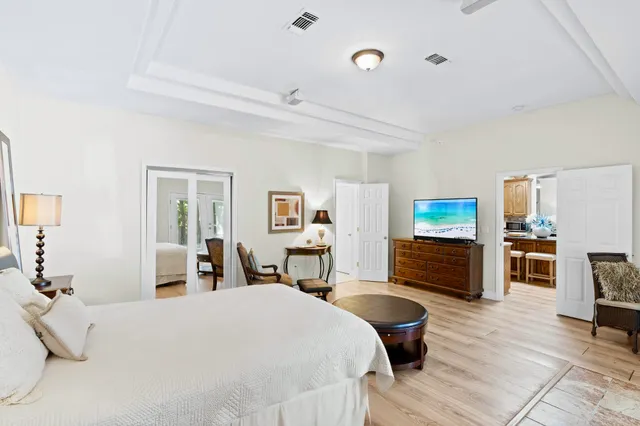 a bedroom with a large bed and furniture