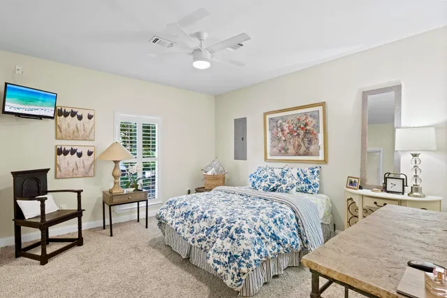 a bedroom with a bed and a table in it