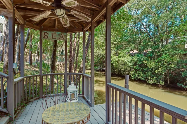 a balcony with table and chairs