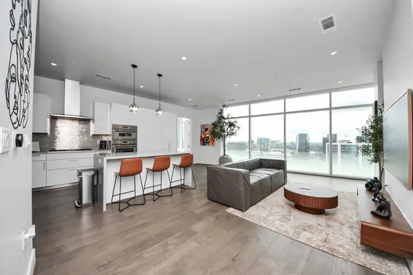 a living room with furniture and a large window