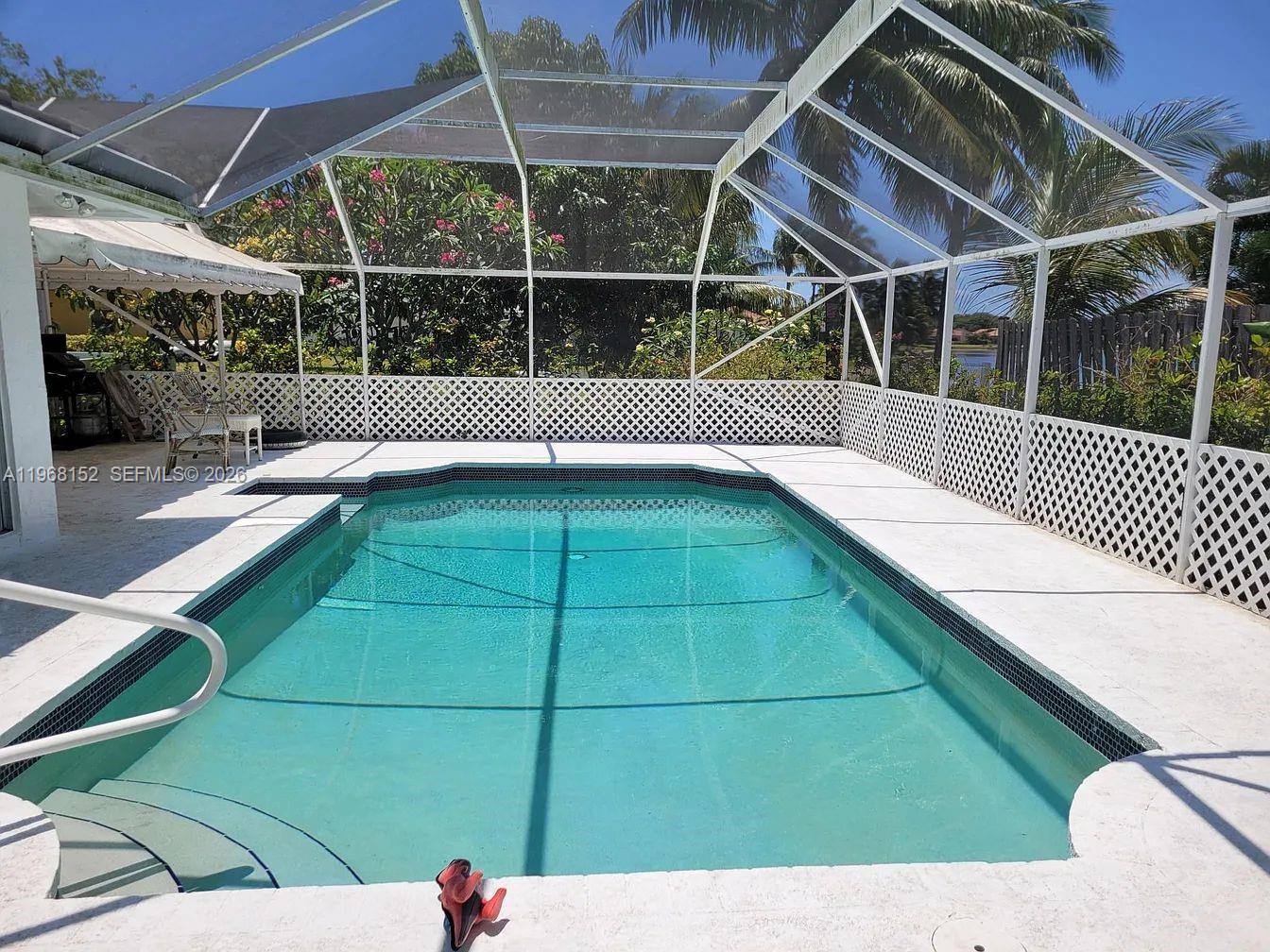 412 Northwest 72nd Street Boca Raton, FL 33487 - Photo 3 of 13 a view of a backyard