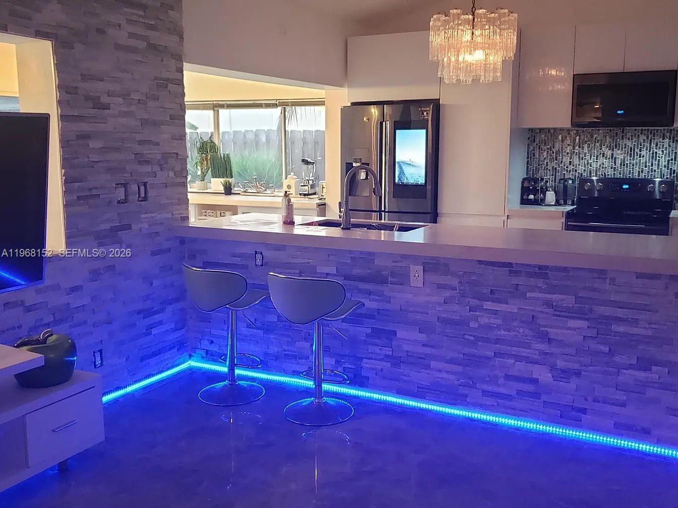 412 Northwest 72nd Street Boca Raton, FL 33487 - Photo 4 of 13 a room with a fireplace and a fireplace