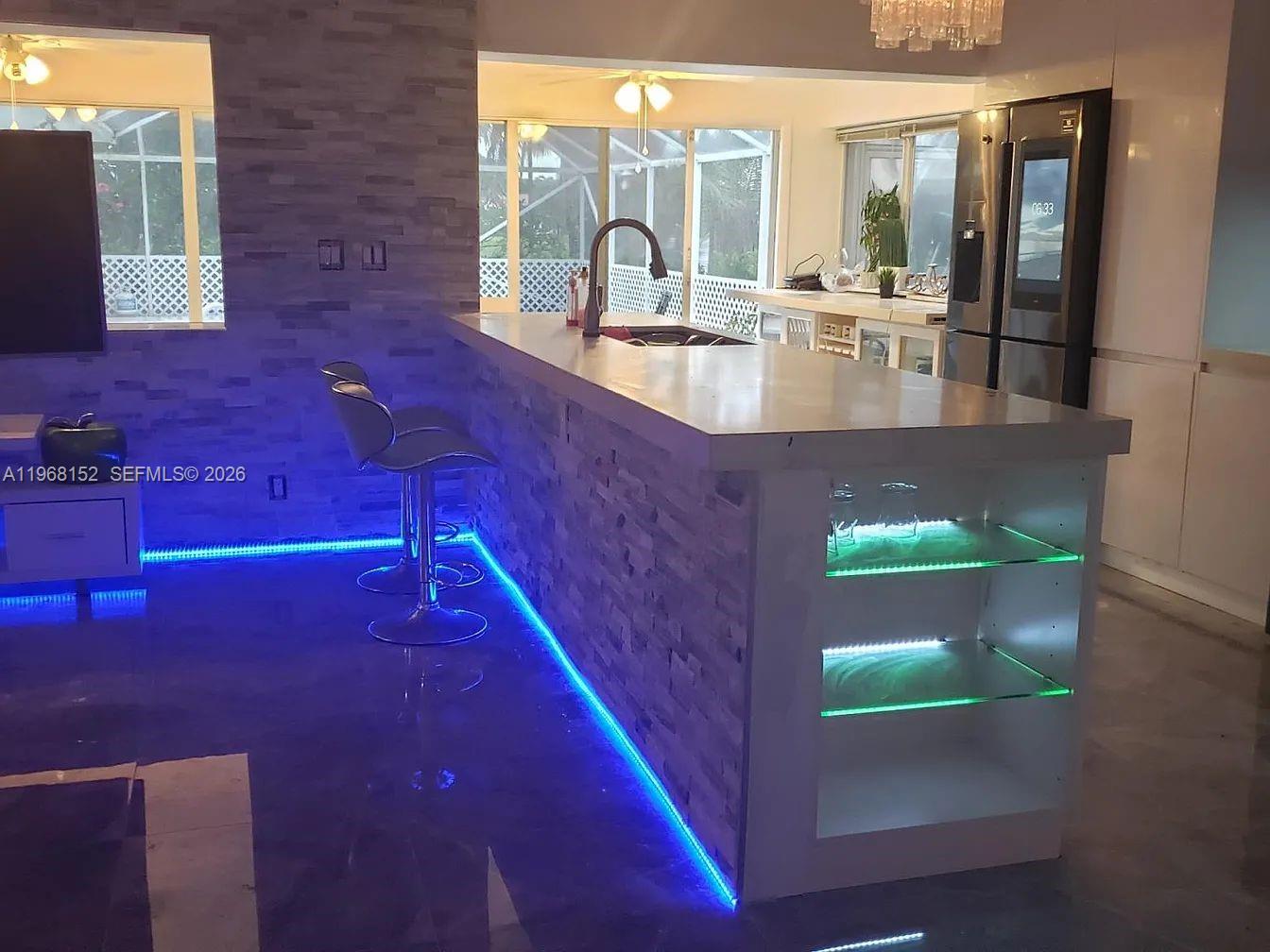 412 Northwest 72nd Street Boca Raton, FL 33487 - Photo 5 of 13 a large pool that has couches in it