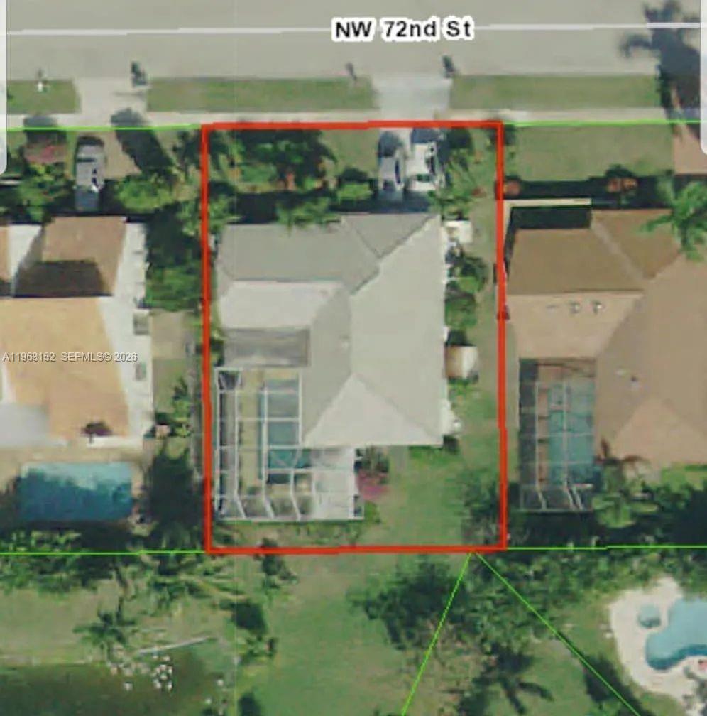 412 Northwest 72nd Street Boca Raton, FL 33487 - Photo 10 of 13 a aerial view of a house with a yard table and chairs
