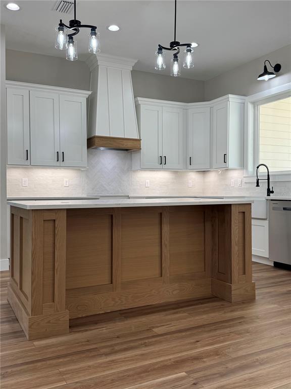 5151 Northwest 73rd Street Chiefland, FL 32626 - Photo 14 of 58 a kitchen with kitchen island sink and cabinets