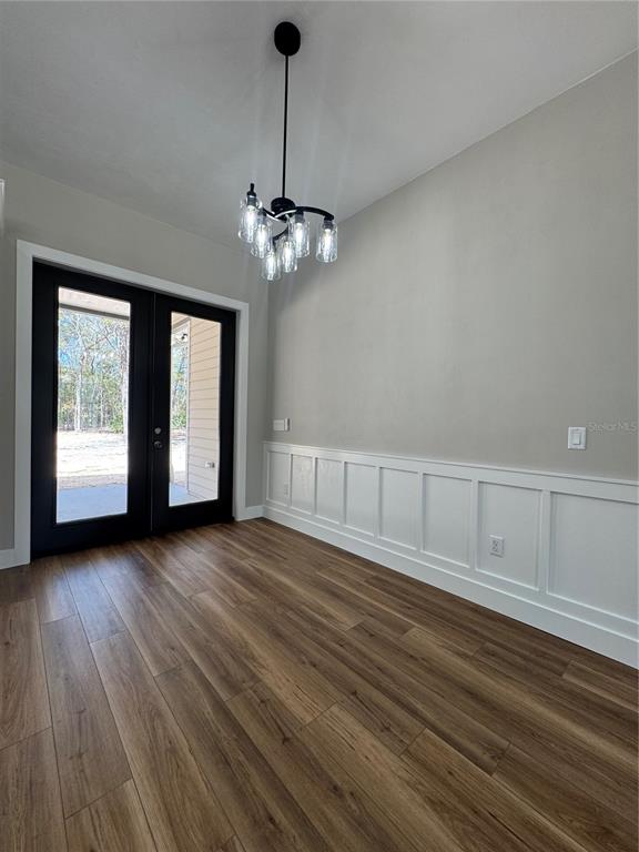 5151 Northwest 73rd Street Chiefland, FL 32626 - Photo 22 of 58 a view of an empty room with wooden floor and a window