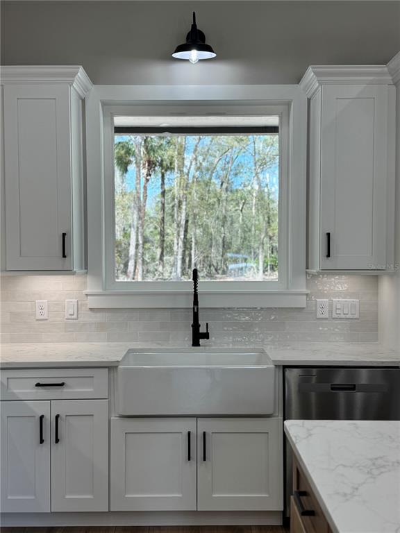 5151 Northwest 73rd Street Chiefland, FL 32626 - Photo 26 of 58 a kitchen with a sink and a window