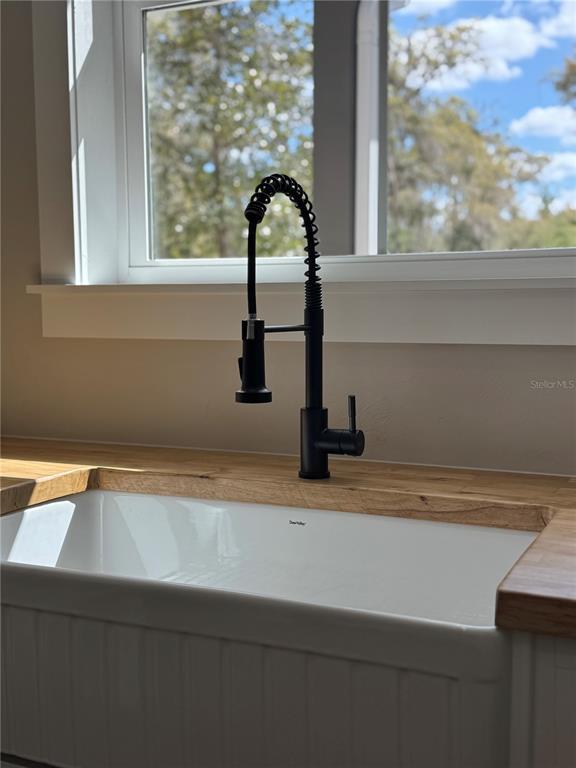 5151 Northwest 73rd Street Chiefland, FL 32626 - Photo 28 of 58 a close view of sink and tap