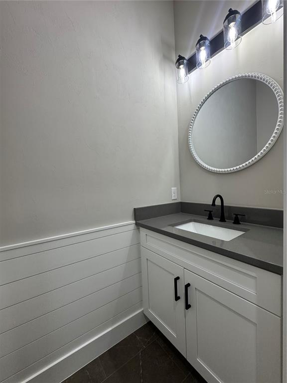 5151 Northwest 73rd Street Chiefland, FL 32626 - Photo 36 of 58 a bathroom with a sink and a mirror