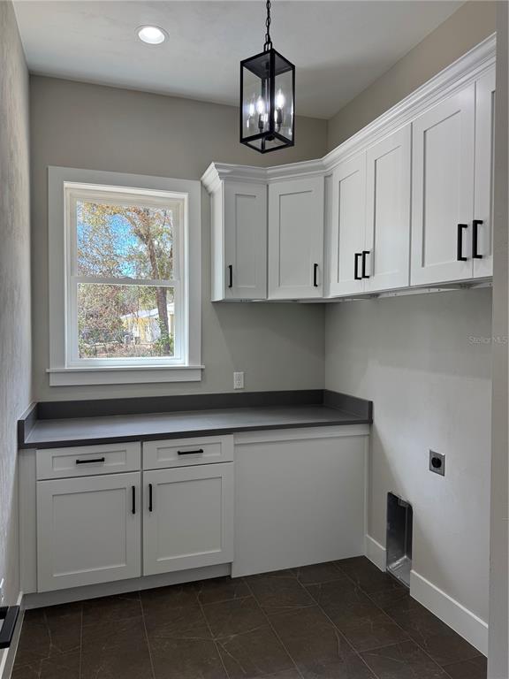 5151 Northwest 73rd Street Chiefland, FL 32626 - Photo 37 of 58 a kitchen with stainless steel appliances granite countertop white cabinets and a window