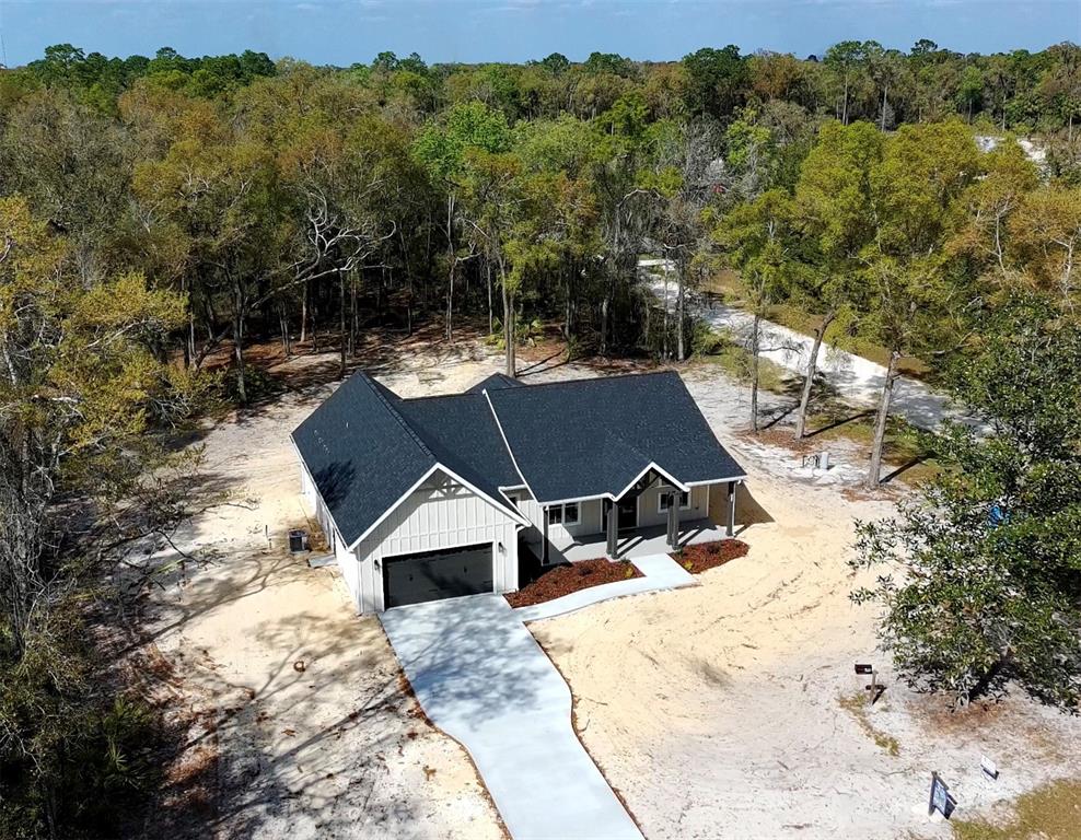 5151 Northwest 73rd Street Chiefland, FL 32626 - Photo 4 of 58 an aerial view of a house with a yard
