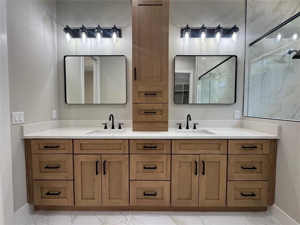 5151 Northwest 73rd Street Chiefland, FL 32626 - Photo 42 of 58 a spacious bathroom with double sink and a mirror