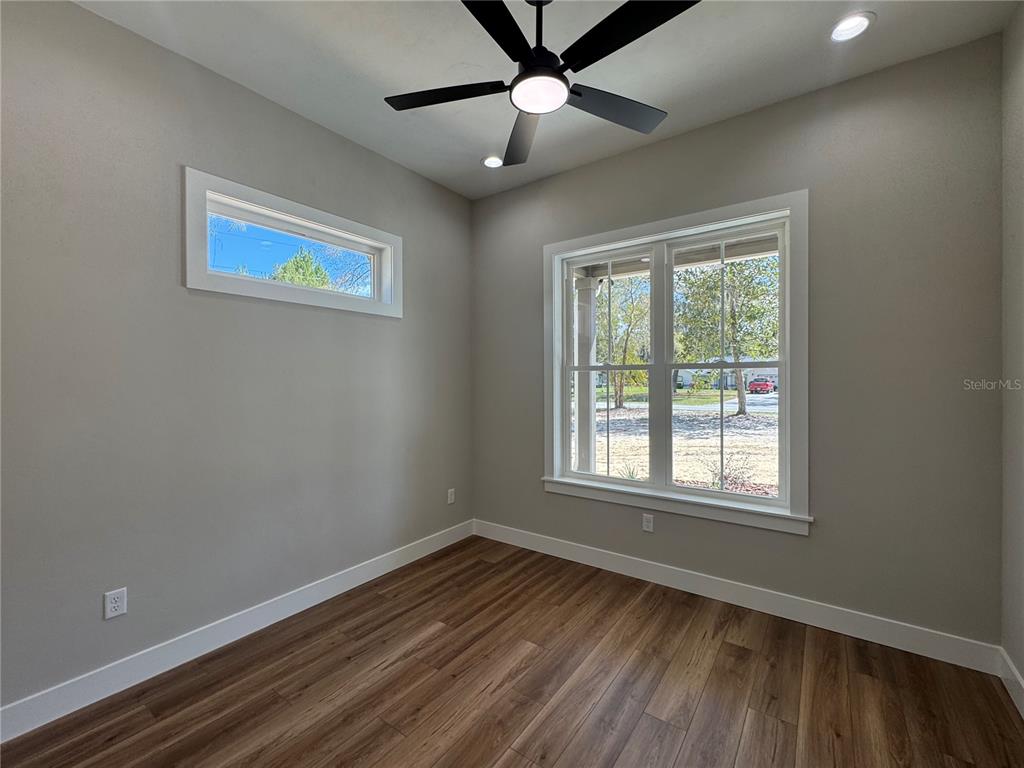 5151 Northwest 73rd Street Chiefland, FL 32626 - Photo 49 of 58 a view of an empty room with wooden floor and a window