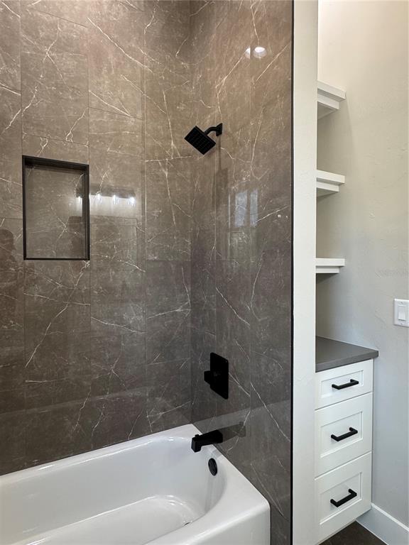 5151 Northwest 73rd Street Chiefland, FL 32626 - Photo 52 of 58 a bathroom with a bathtub and a shower