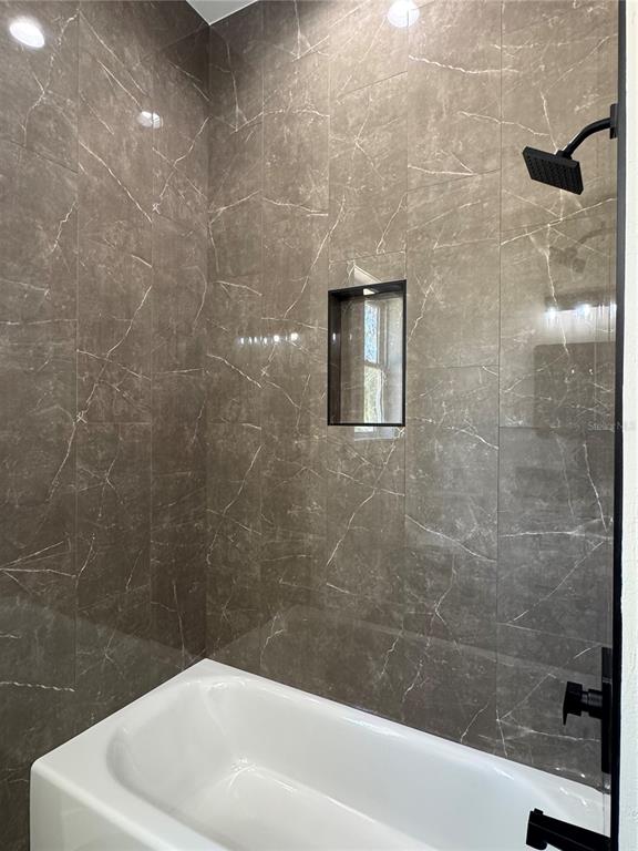 5151 Northwest 73rd Street Chiefland, FL 32626 - Photo 53 of 58 a bathroom with a white bathtub