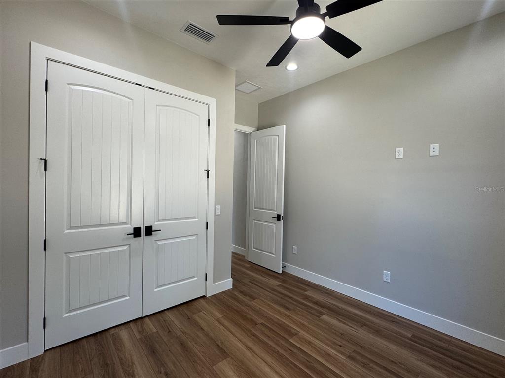 5151 Northwest 73rd Street Chiefland, FL 32626 - Photo 56 of 58 wooden floor in an empty room with a window