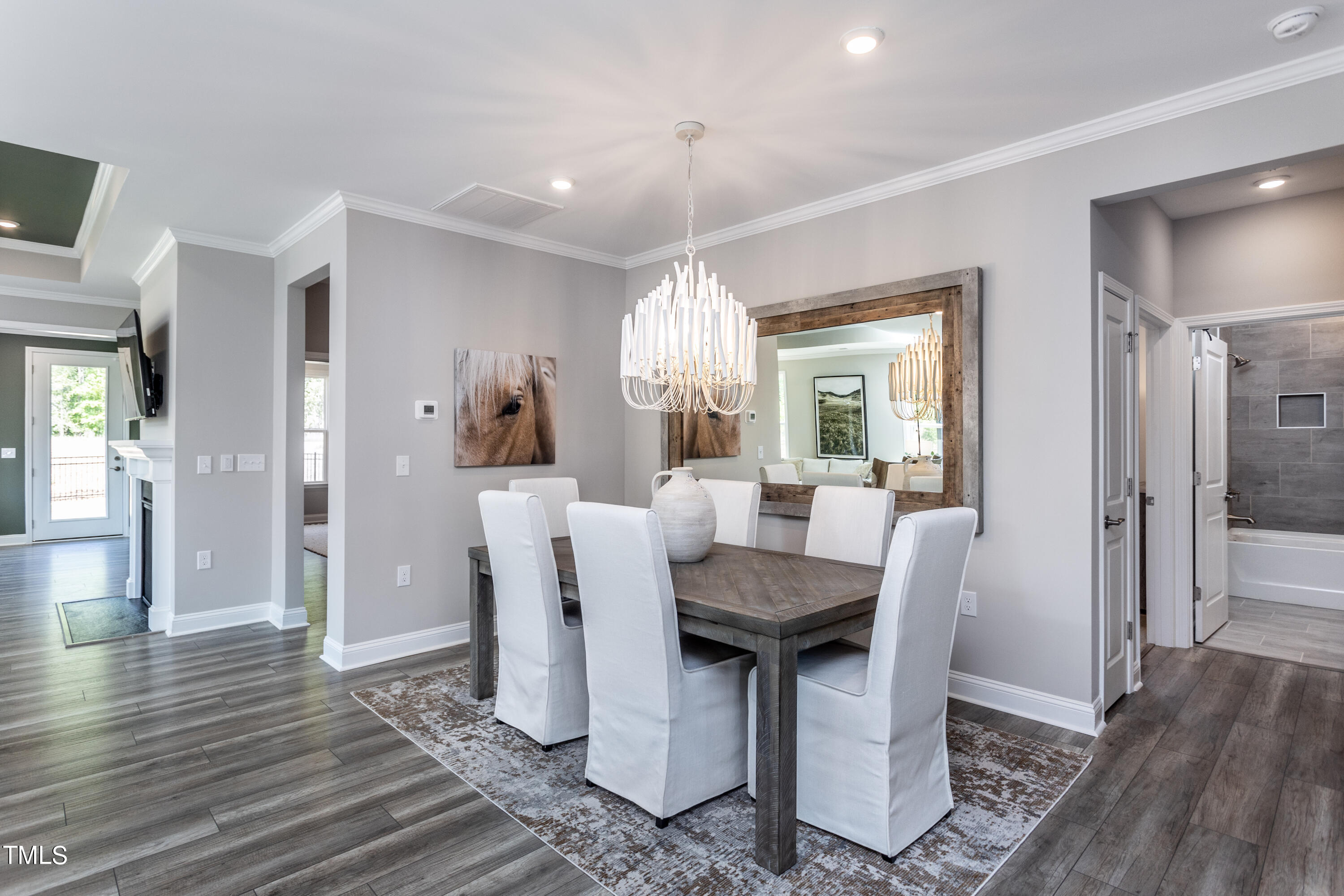 71 Secretariat Drive Clayton, NC 27520 - Photo 14 of 24 a view of a dining room with furniture window and wooden floor