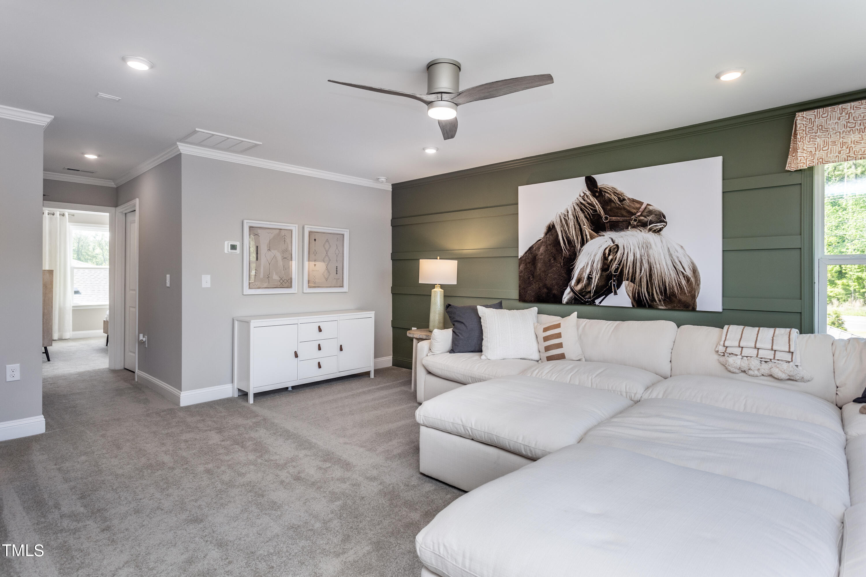 71 Secretariat Drive Clayton, NC 27520 - Photo 22 of 24 a living room with furniture and white walls