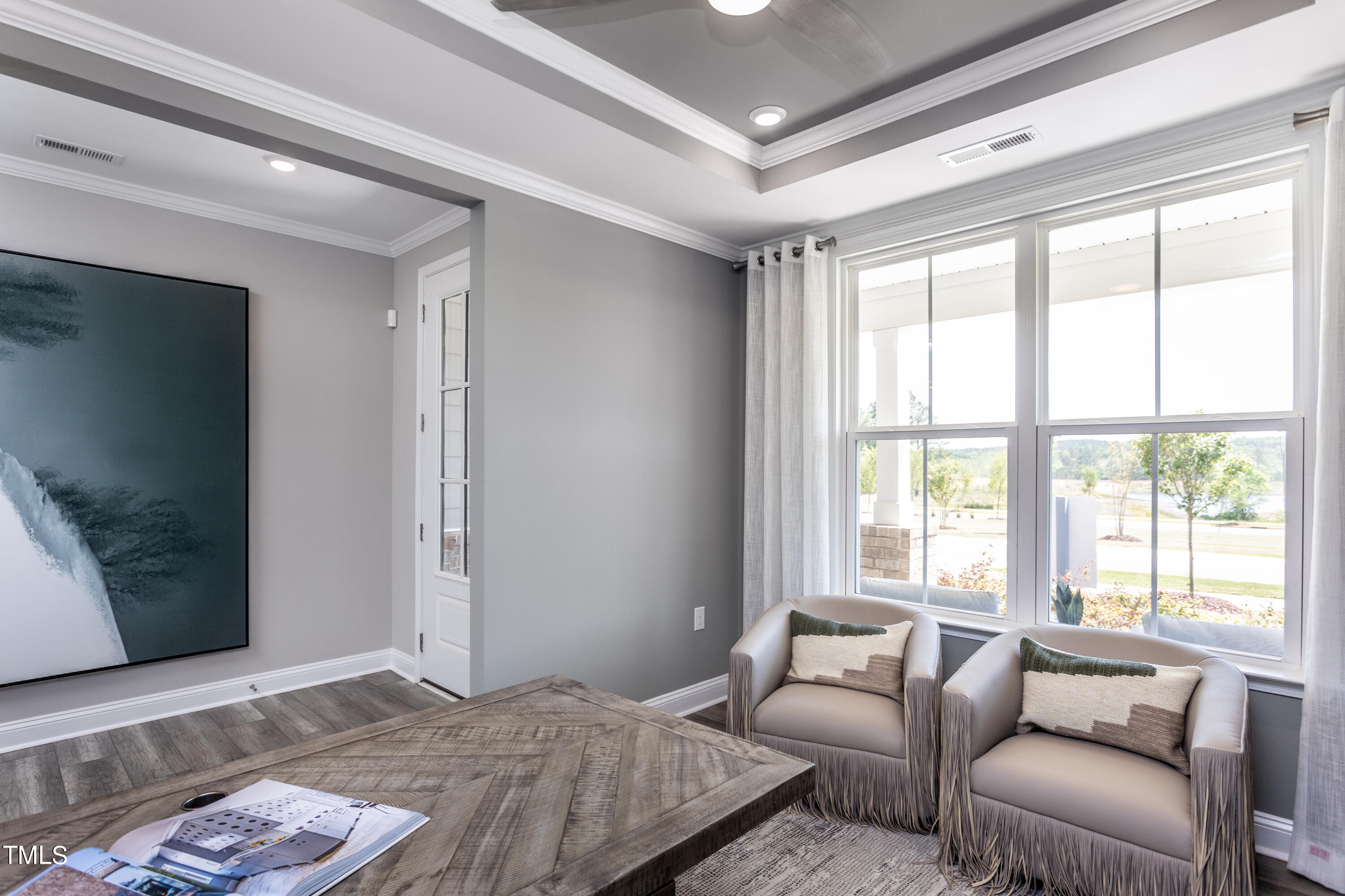 71 Secretariat Drive Clayton, NC 27520 - Photo 3 of 24 a bedroom with furniture and a flat screen tv