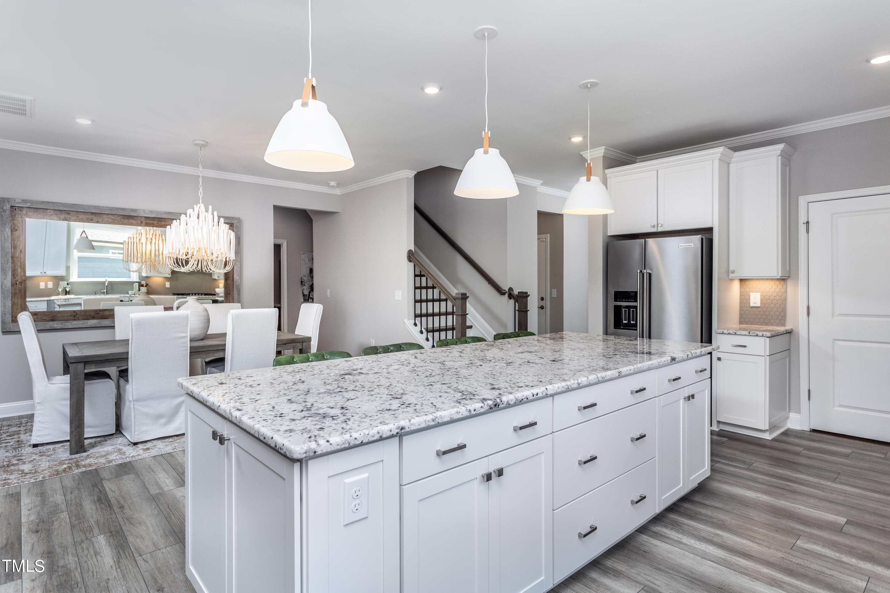 71 Secretariat Drive Clayton, NC 27520 - Photo 7 of 24 a kitchen with a table and chairs in it