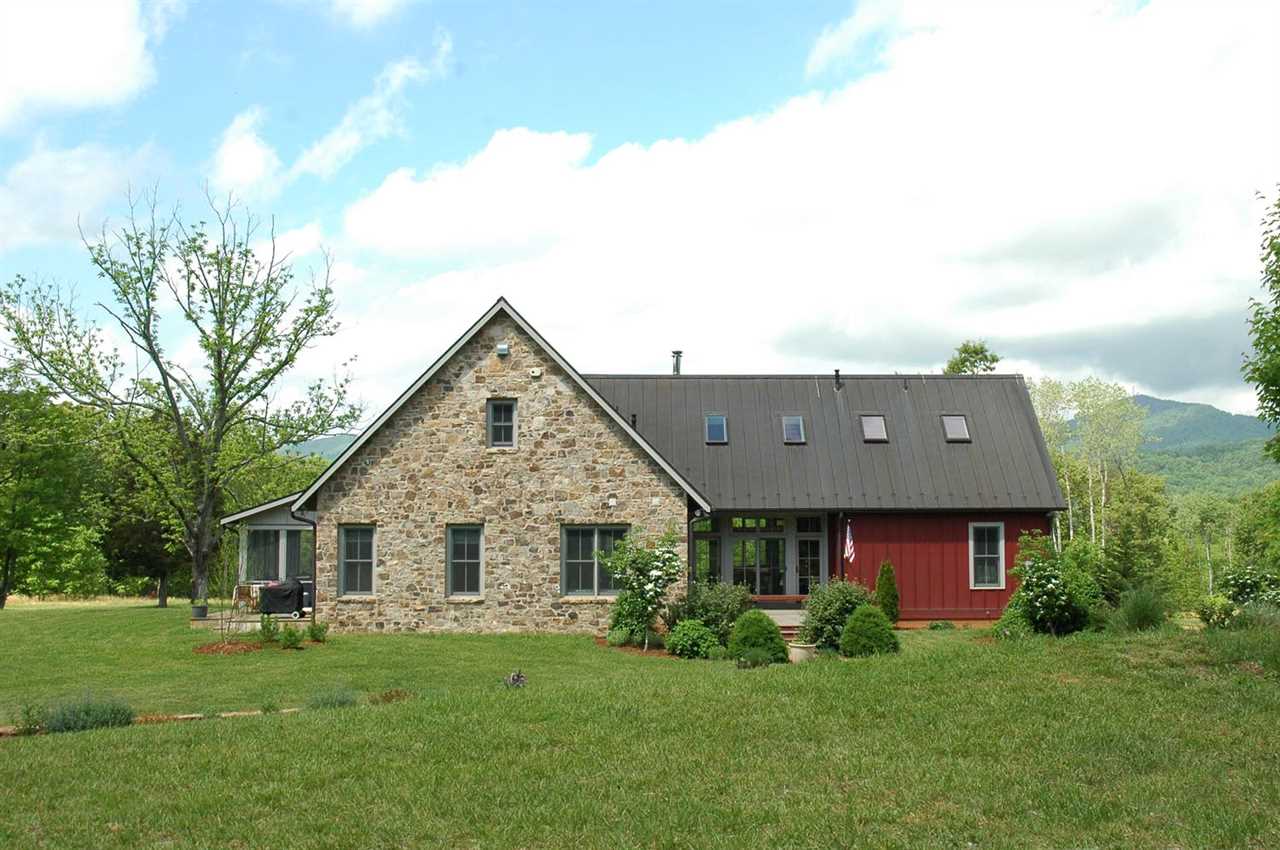 4981 Laurel Road Shipman, VA 22971 - Photo 1 of 34 a view of a house with a big yard potted plants and a large tree