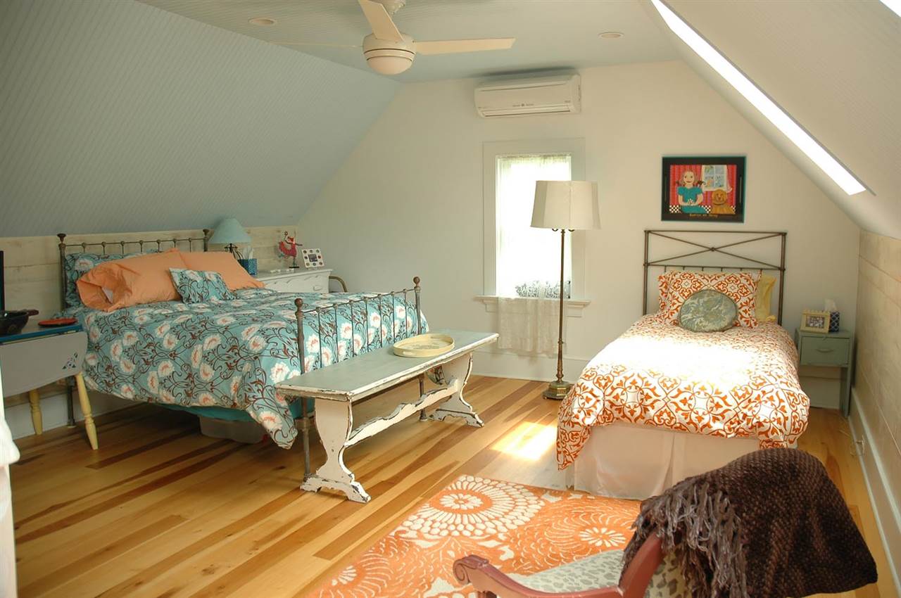 4981 Laurel Road Shipman, VA 22971 - Photo 19 of 34 a bedroom with a bed and wooden floor