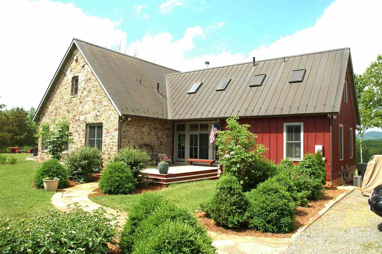 4981 Laurel Road Shipman, VA 22971 - Photo 2 of 34 a front view of a house with a yard