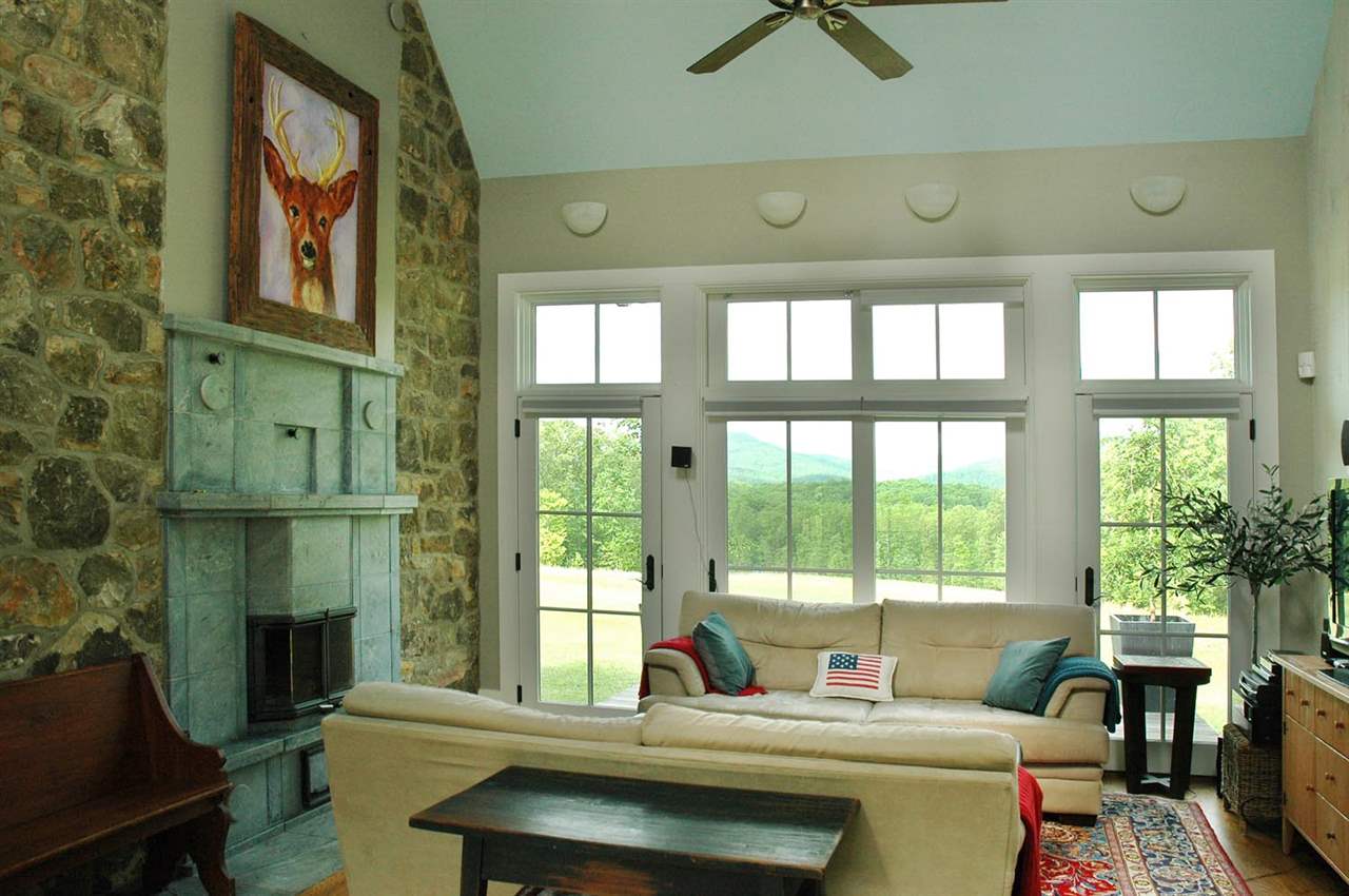 4981 Laurel Road Shipman, VA 22971 - Photo 7 of 34 a living room with furniture and a floor to ceiling window