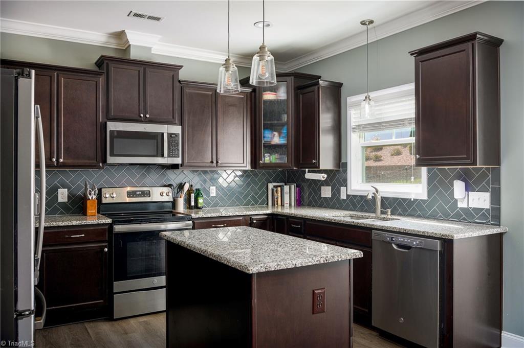 2929 Fernley Court High Point, NC 27262 - Photo 7 of 36 Gorgeous kitchen with granite countertops and tile backsplash