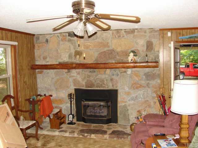 4812 Bahama Road Rougemont, NC 27572 - Photo 3 of 8 a living room with a fireplace