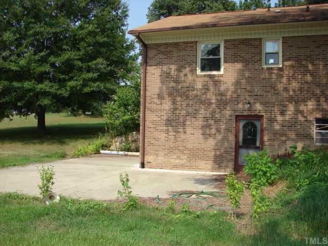 4812 Bahama Road Rougemont, NC 27572 - Photo 7 of 8 a front view of a house with a yard
