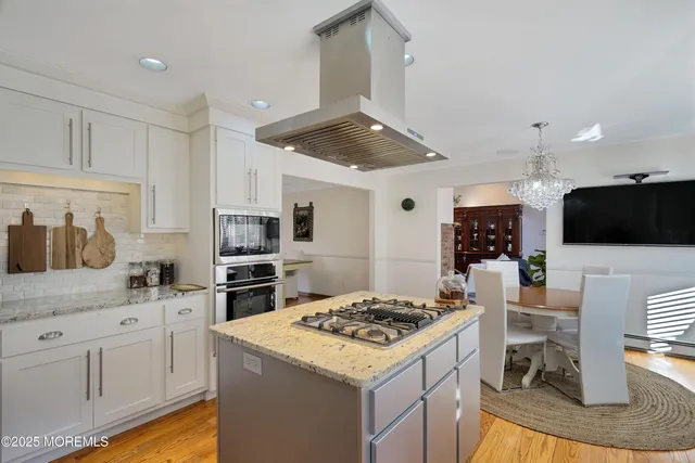 a living room with furniture a fireplace and a table