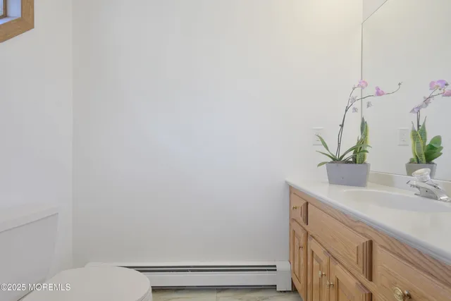 a bedroom with two beds and a window